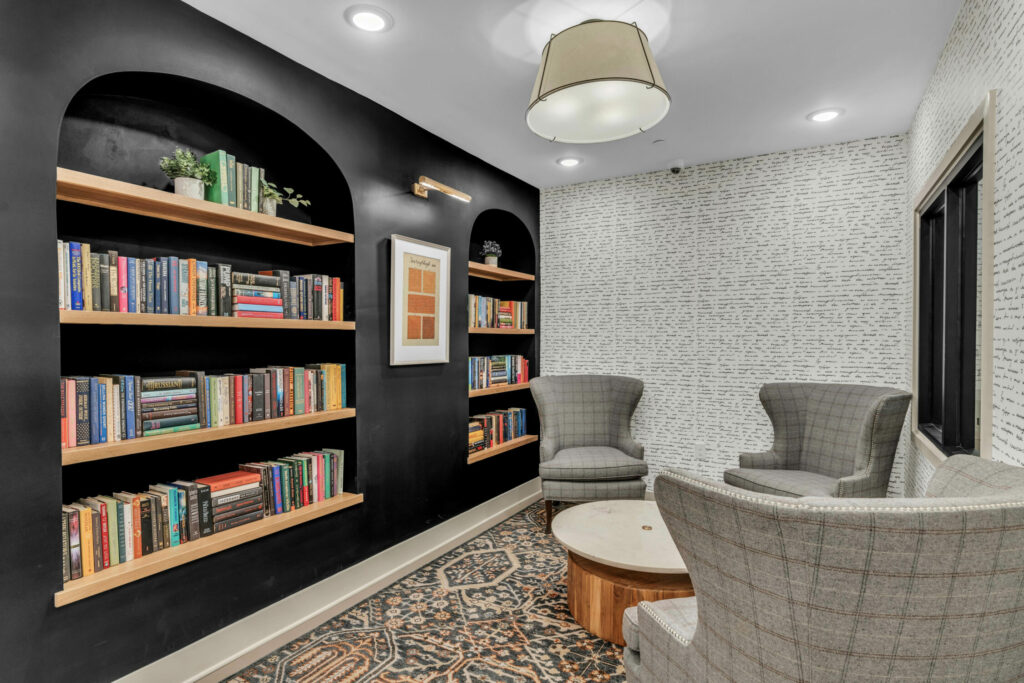 Where Productivity Meets Luxury - maker's space and quiet library with comfortable seating and bookshelves