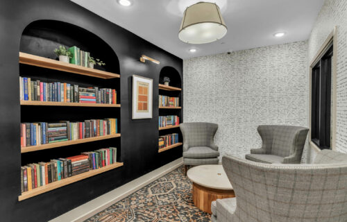 Where Productivity Meets Luxury - maker's space and quiet library with comfortable seating and bookshelves