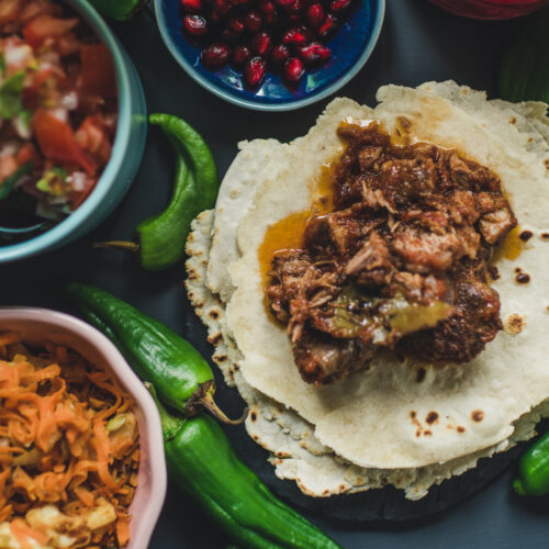 The rich flavors of Mexico and Texas - Mexican Tex-Mex dinner served on a dark blue table
